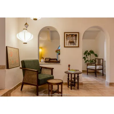 A quiet nook in our studio, featuring the Ballygunge chair and Vibhinna side table. This space is where we meet with clients, share stories, and begin the collaborative process of designing their dream furniture.