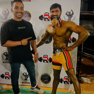Celebrating a hard-earned victory with my client. My role as a coach extends to being there backstage, providing last-minute support and ensuring my athletes are confident and ready.