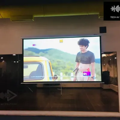 An Epson Full HD projector and a 120-inch motorized screen we installed in a Mumbai gym. This setup provides a big-screen experience for members, adding significant value to the facility.