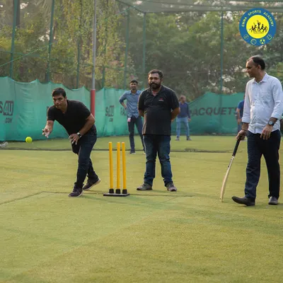 A player delivers a fast bowl during a competitive game of box cricket. Our turf is the perfect arena for bowlers and batsmen to test their skills against each other.