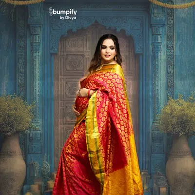 Celebrating motherhood with timeless tradition. This mom-to-be looks absolutely radiant in a vibrant red and gold Banarasi saree, posed against a classic, ornate blue doorway in my studio.
