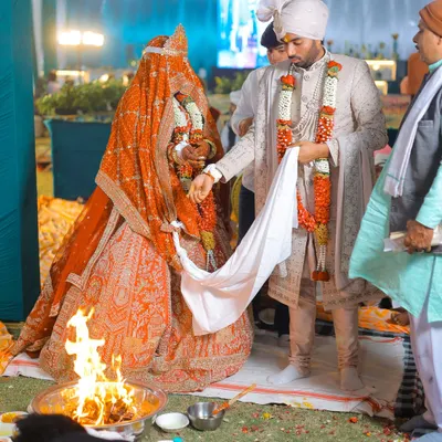 A key moment from a Hindu wedding ceremony, as the couple performs the pheras around the sacred fire. I capture these rituals from angles that show the tradition and emotion.