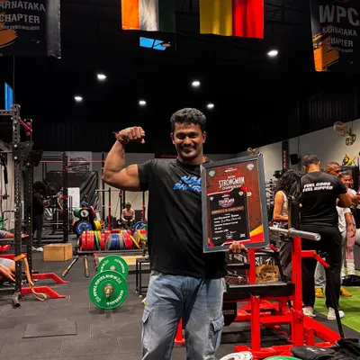 Holding the "Strongman of India" 2025 trophy. This is the culmination of countless hours of training and sacrifice.
