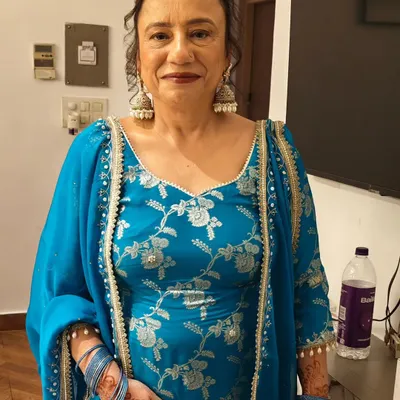 Makeup for mature skin is all about enhancing, not hiding. For this lovely client, I focused on creating a luminous base and adding a pop of color with her beautiful blue suit.