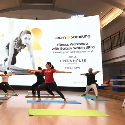 We guide employees through foundational asanas like Virabhadrasana II (Warrior II pose) during a corporate wellness workshop. This session, held in partnership with Samsung at the Opera House in Bengaluru, was designed to improve focus and reduce workplace stress through accessible yoga practices.