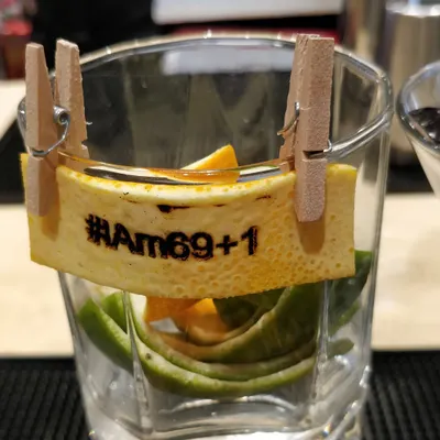 A perfect example of our personalized service. For this 70th birthday, we created custom orange peel garnishes heat-stamped with the event's hashtag, "#IAm69+1," adding a witty and memorable touch to each drink.