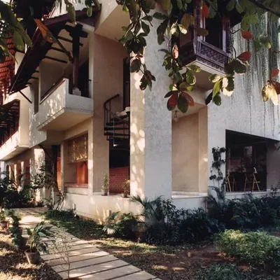The Ayushakti Health Resort in Mumbai, a tranquil oasis designed on a narrow urban plot. The building's form uses setbacks and balconies to maximize light and air.