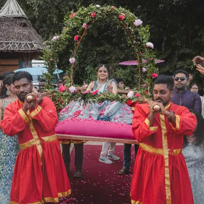 Who says the baraat is just for the groom? For Supreetha, we designed a royal bridal baraat with a custom-made carriage, so she could make her entrance like the princess she is, showered with petals by her loved ones.