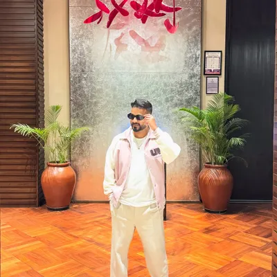 A stylish pose against a backdrop of modern art.