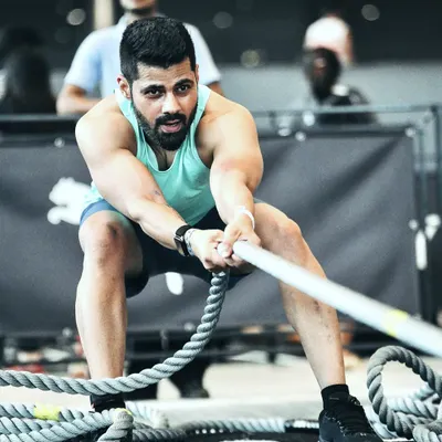 Pushing Past Perceived Limits. This is the face of determination during a Hyrox competition. Every rope pull, every meter run is a test of physical and mental strength. I don't just coach this lifestyle, I live it.