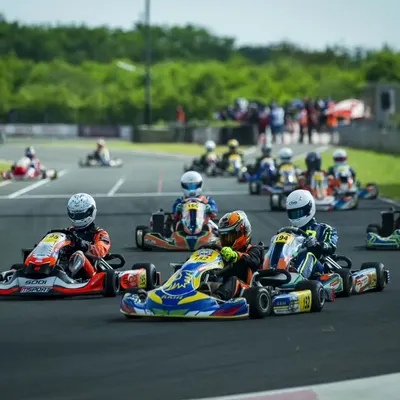 The moment before the lights go out. A full grid of senior max drivers at the National Rotax Max Karting Championship, all fighting for position into the first corner.