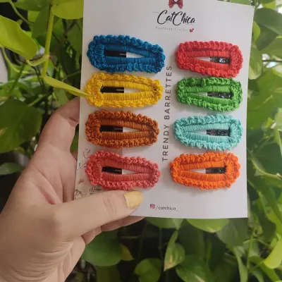 Our trendy crochet barrettes are a must-have for adding a pop of color. This set of eight comes with a rainbow of colors to match any outfit.