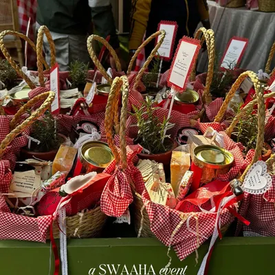 Adorable picnic baskets filled with goodies for a sunflower-themed baby shower. These personalized favors were part of a rustic, storybook-like celebration.