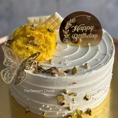 My signature Royal Rasmalai cake. This eggless cake is infused with the delicate flavours of rasmalai and garnished with pistachios and a piece of the sweet itself.
