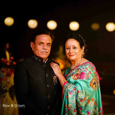 A beautiful, classic portrait of the groom's parents. Their proud and happy expressions are a wonderful part of the wedding story.
