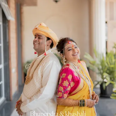 A joyful, candid moment between a Maharashtrian bride and groom. I love capturing these unscripted laughs that show the couple's true personality.