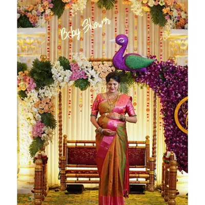 Capturing the mother-to-be during her baby shower ceremony. I document all the details, from the elaborate floral decorations and traditional swing to the happy glow on her face.