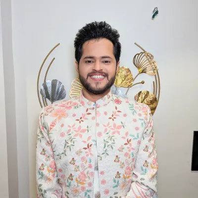 A groom in a beautiful floral sherwani. This is a fresh and modern take on traditional wedding wear, perfect for a day event.
