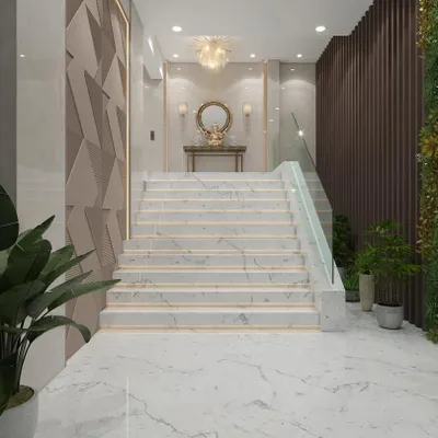 For this lobby in Nerul, we designed a grand marble staircase with a minimalist glass railing to create an open and impressive entryway. The combination of textured wall panels, ambient lighting, and integrated planters demonstrates our skill in creating layered, sophisticated commercial spaces.