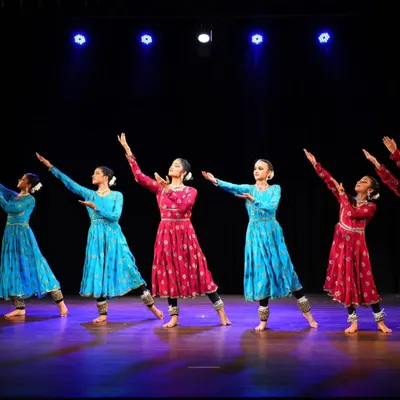 My students presenting their group choreography 'ARAMBH' on stage. Their synchronized movements and graceful postures reflect countless hours of dedicated practice.