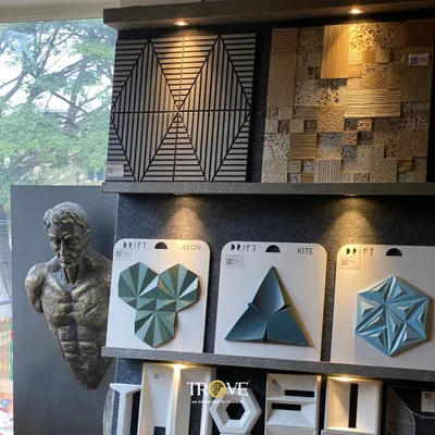 This display showcases a variety of my luxury 3D tiles. From geometric patterns that play with light and shadow to uniquely shaped tiles in striking colors, these designs are perfect for creating a modern and sophisticated feature wall that becomes a work of art itself.