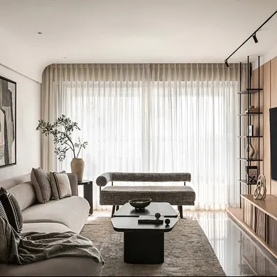 A look at a complete living space where every zone has its own personality yet flows together. This project combines a formal living area, a cozy guest corner, and a media unit, all unified by a warm, stylish aesthetic.