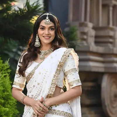 For a soft, angelic look, we styled this white and gold lehenga with a beautiful Kundan choker and maang tikka. It is a perfect choice for a daytime reception or sangeet.