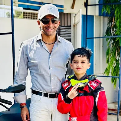 A star in the making. Our young driver gets a photo with Indian racing legend Narain Karthikeyan, a moment of inspiration for any aspiring champion.