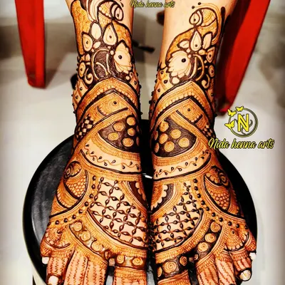 This intricate bridal feet design was done by my talented students. It features peacock motifs and detailed patterns that cover the feet beautifully.