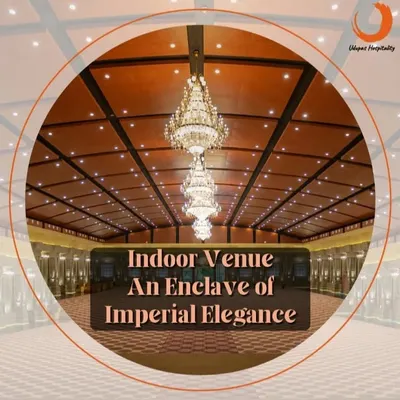 The imperial elegance of our Maanikya indoor venue. The intricate ceiling design and grand chandeliers provide a majestic atmosphere for any high-profile event or luxury wedding.