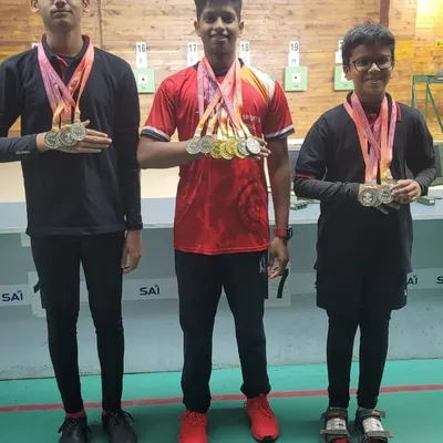 Our young champions proudly displaying their medals after a successful competition. We focus on developing talent from a young age, building a strong foundation for a long and successful shooting career.