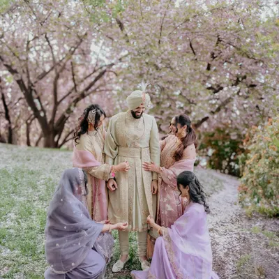 Who says only brides get the Pinterest-worthy shots? We had a great time capturing the groom, Gurtaj, with his sisters under a shower of cherry blossoms. A beautiful and fun moment.