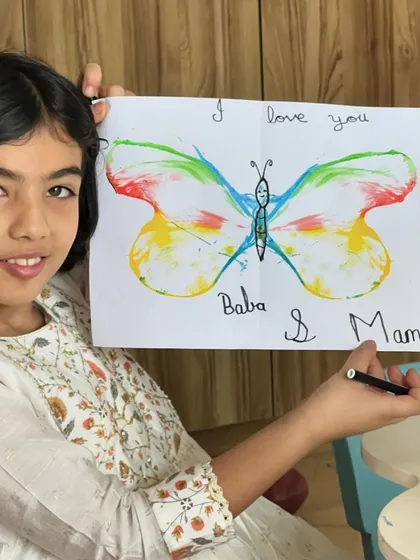 This beautiful butterfly was made with a special thread-painting technique and is filled with a sweet message for her parents. Art from the heart!