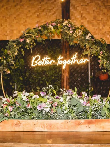 Small details make a big difference. A custom neon sign like this "Better together" piece adds a trendy and personal touch to your decor, perfect for placing on the main stage or at the welcome table.