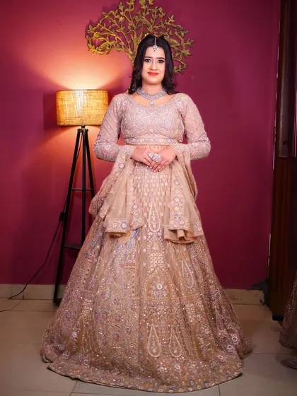 A full-length view of our pastel peplum lehenga, a modern and chic choice for any wedding guest.