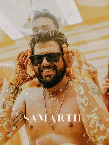 A cool portrait of the groom, Samarth, during his Haldi. Even covered in petals, his swag shines through with the sunglasses, capturing a fun and memorable moment.