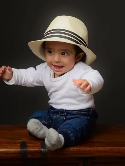 Adding a simple prop like a hat can completely change the feel of a photo. This little one looks ready for an adventure.