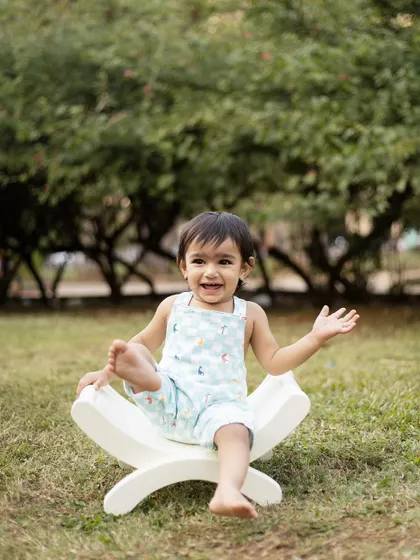 A big, happy laugh from this little one during his outdoor sitter session. The natural light is perfect for capturing these bright and airy portraits.