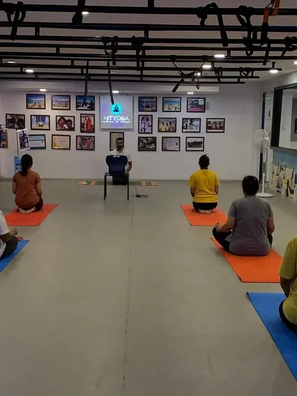 Leading a meditation session on International Yoga Day. Guiding my students to find stillness and connect with their inner selves is one of the most rewarding parts of my work.