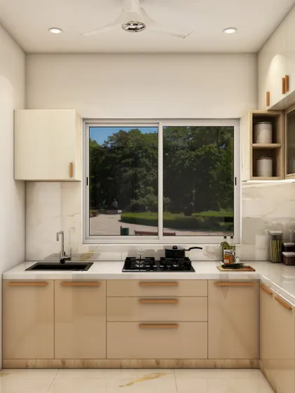 This L-shaped kitchen design features warm beige cabinets, a large window for natural light, and a clean, functional layout perfect for everyday cooking.