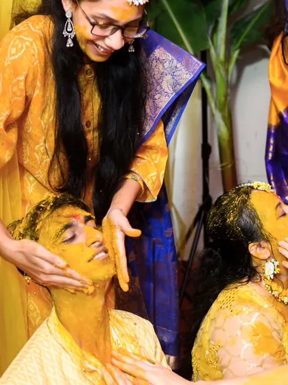 The groom, Rugved, getting a double dose of haldi from his family. It’s a ritual of love and blessings, and also a lot of fun.