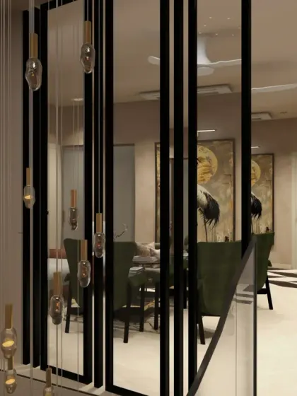 For Meghlan's residence in Gurgaon, I crafted this foyer and staircase to make a lasting impression, with a statement chandelier reflected in sleek MS glass partitions.