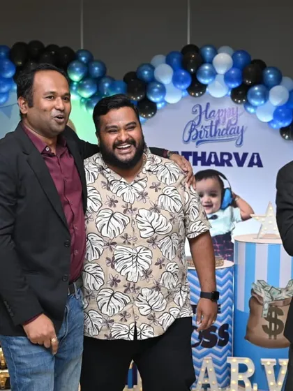 Sharing a laugh with the hosts of the party. It's important for me to connect with the family and ensure they are enjoying the event as much as their guests.