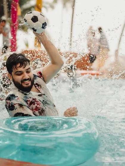 The groom having a blast during a Haldi pool party, perfectly capturing the fun and festive energy of the celebration. I plan events where everyone, especially the couple, can let loose and have fun.