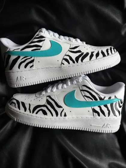 A pair shot of the zebra stripe custom sneakers.