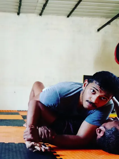 Demonstrating side control, one of the most dominant positions in grappling. From here, we teach how to maintain control and look for submissions.