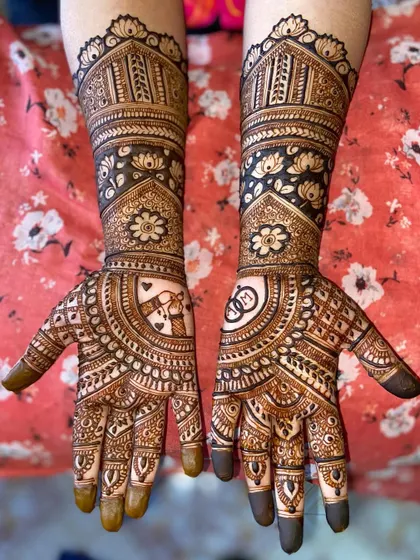 A clear, full view of the heart and rings mehandi, showing how the personal touches are beautifully integrated into the traditional design.