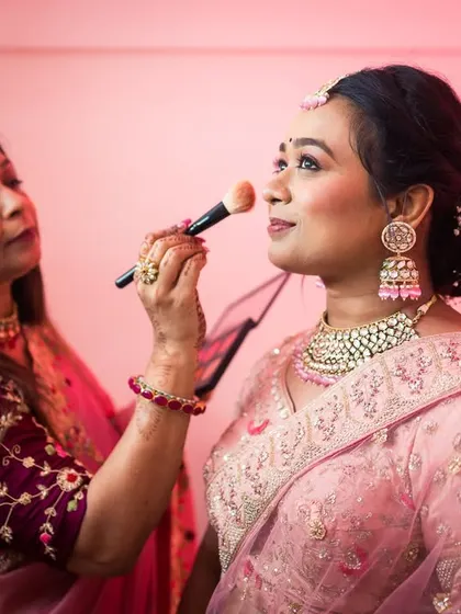 A touching moment as the bride, Shivani, gets her makeup done by her mother.