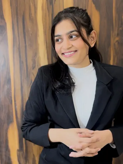 A relaxed and happy portrait. Behind the serious lawyer is a person who is passionate about justice and helping others.