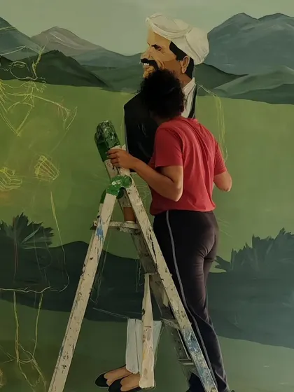 A photo from my time in Coorg, showing me on a ladder, sketching out the figures before painting.